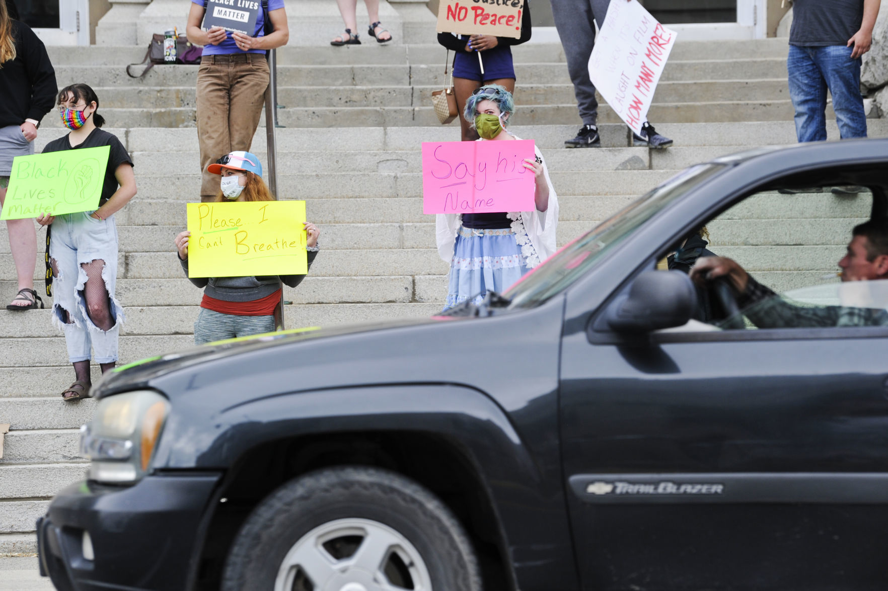 Protesters gather on the steps of the City-County Building Friday